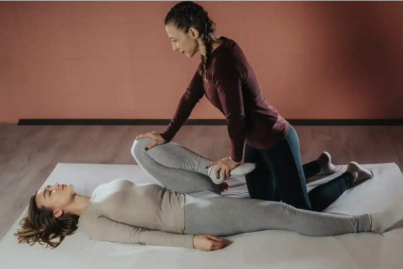 Practitioner guiding assisted bodywork